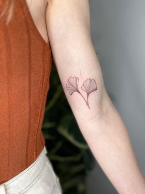 Elegant ginko leaf design by jadeshaw_tattoos, in a delicate illustrative style.