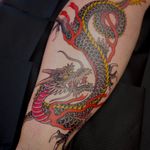 Experience the power and beauty of a traditional Japanese dragon tattoo by the skilled hands of artist Martin Kirke.