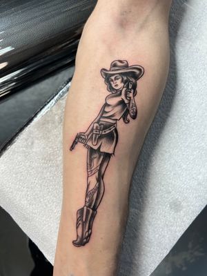 Classic cowgirl motif with a feminine touch by Kayleigh Cole, done in traditional tattoo style.