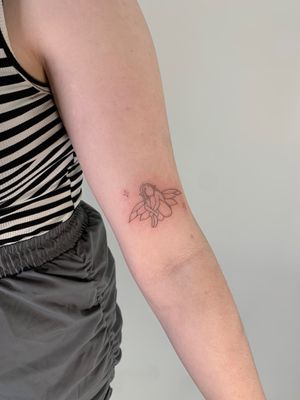 Experience the enchantment with this dainty and intricate fairy tattoo, expertly crafted by Chloe Hartland in fine line illustrative style.