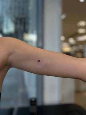 Get a beautifully crafted small lettering tattoo by the talented artist Faith Llewellyn. Perfect for those looking for a delicate and meaningful design.