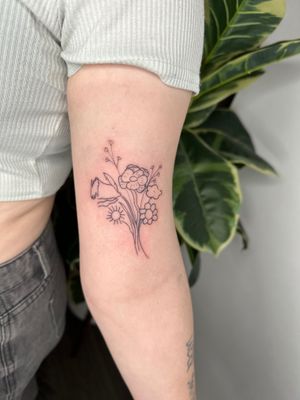 Admire the intricate details of this bouquet tattoo by jadeshaw_tattoos, featuring a delicate bundle of flowers in fine line style.