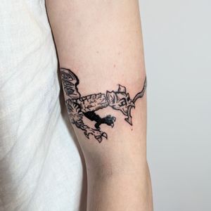 Get a stunning gargoyle tattoo with intricate blackwork design by the talented artist Adam McDade.