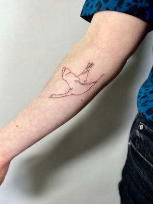 Get a stunning illustrative tattoo of a single line goose by the talented artist, Charlotte Pokes.