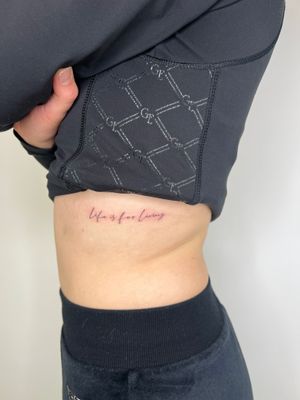Fine line lettering tattoo by Emma InkBaby, showcasing small and intricate script design.