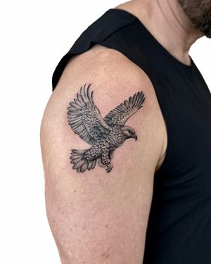 Discover the fierce beauty of this illustrative eagle tattoo by Alex Lloyd. A symbol of power and freedom.