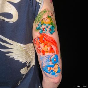 Get inked with the cutest starter Pokemon- Bulbasaur, Squirtle, and Charmander in a vibrant anime watercolor style by the talented artist Marie Terry.