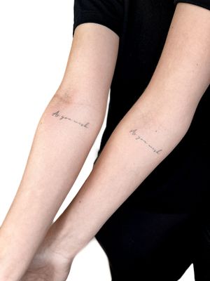 Get a unique and delicate fine line tattoo with small lettering by the talented artist Alex Lloyd. Perfect for those who appreciate minimalistic designs.