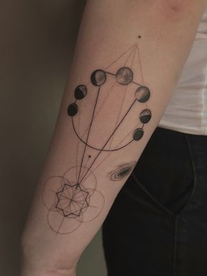 Discover the beauty of the moon phases with this intricate black and gray illustrative tattoo by Saka Tattoo.