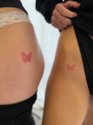 Timmy expertly crafted a fine-line illustrative tattoo of a dainty red butterfly, perfect for those looking for a subtle yet striking design.