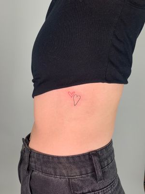 Show your love with this intricately detailed heart tattoo created with fine line technique by renowned artist Chloe Hartland.