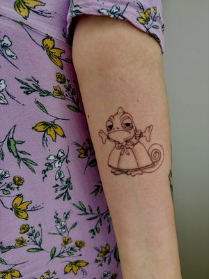 Admire the intricate details of this adorable chameleon tattoo by Ruth Hall. Perfect for those who love cute and illustrative designs.