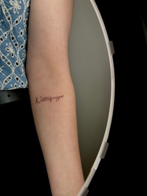 Get a unique tattoo by Ruth Hall with delicate lettering and precise fine line work. Perfect for a subtle and sophisticated look.