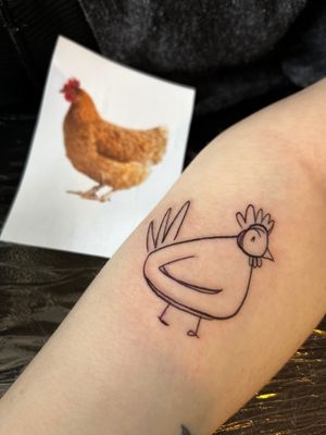 Get an eccentric chicken doodle tattoo by artist Jonathan Glick, perfect for those looking for a fun and unique design.