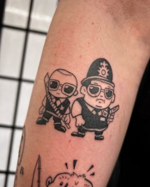 Get the quirky charm of Hot Fuzz with this edgy illustrative tattoo by Jonathan Glick. Stand out from the crowd!
