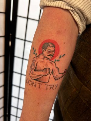 Get a knockout tattoo of a fierce boxer in a classic traditional style by artist Jonathan Glick.