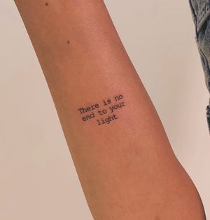 Get a beautiful fine line tattoo with small lettering by the talented Chloe Hartland. Perfect for those who enjoy minimalist designs.