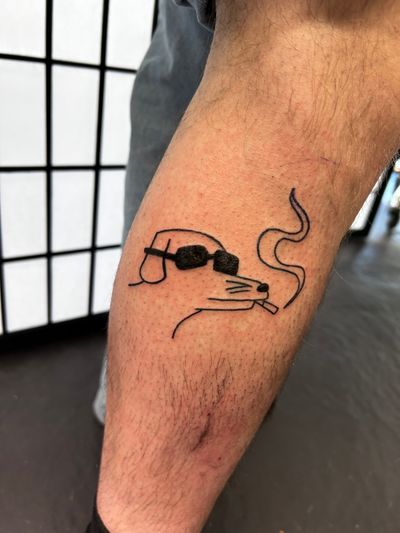 Get a unique ignorant style tattoo featuring a smoking dog doodle, created by the talented artist Jonathan Glick.