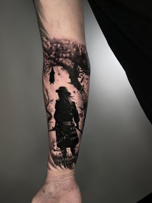 Black and gray tattoo featuring a samurai facing off against a bat, with elements of a haunting tree and Van Helsing's influence. By Santy Taiga.