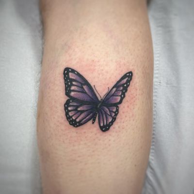 Illustrative butterfly with a purple overlay as a memorial tattoo