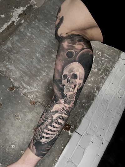 life and death skeleton and dinosaur and galaxies black and grey tattoo full sleeve