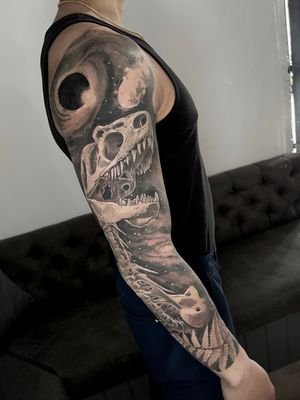 life and death skeleton and dinosaur and galaxies black and grey tattoo full sleeve