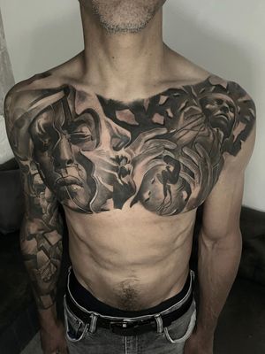 surrealistic chest black and grey tattoo 