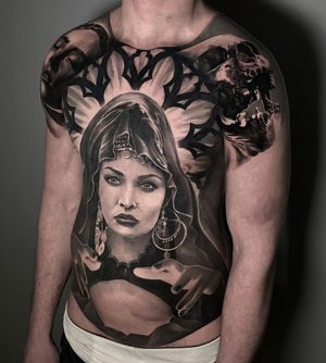 black and grey tattoo of a fortune teller full front