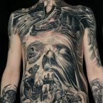 Horror creepy and dark concept surrealism full front torso and neck tattoo