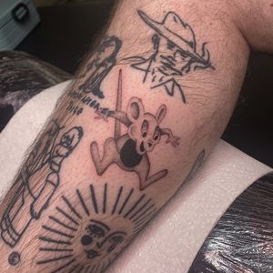 This black and gray tattoo of a kangaroo, done by Charlie Macarthur, captures the spirit of the Australian outback.