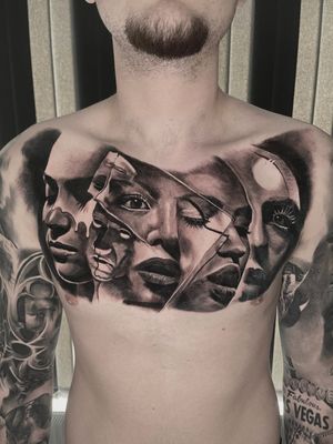surrealistic chest black and grey tattoo 