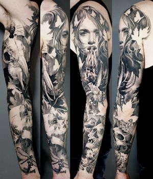 Black and grey healed full sleeve tattoo of life and death