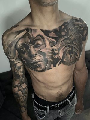 surrealistic chest black and grey tattoo