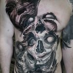 creepy horror black and grey full front torso tattoo in progress