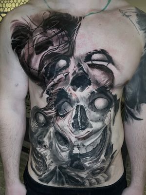 creepy horror black and grey full front torso tattoo in progress