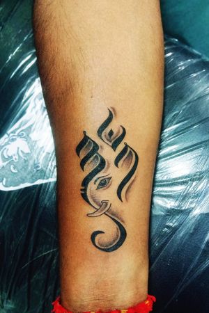 Om with lord Ganesha tattoo on inner forearm.... Tattoo done by @satishmandhare910.. 📝Book your appointment on 8433934833☎️ #om #omtattoo #lordganesha #omcalligraphytattoo #sanatandharma #hinduculture #tattoo #tattoos #tattooed #ink #inked #tattoodo #art #artist #artlife #artistforlife #royal