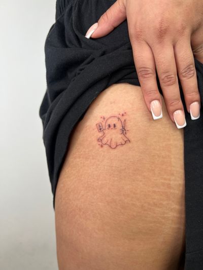 Delicate and cute fine line tattoo of a kawaii ghost, by Emma InkBaby.