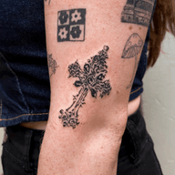 Ornate cross crucifix Catholicism tattoo