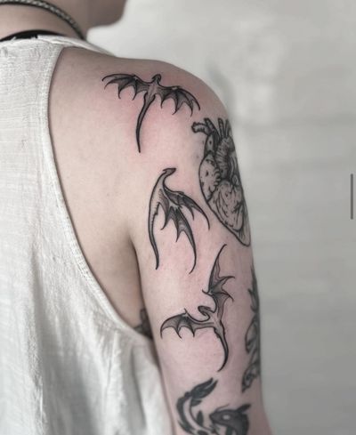 Discover the mythical world with this detailed black and gray dragon tattoo by Claudia Smith. A masterpiece in ink!