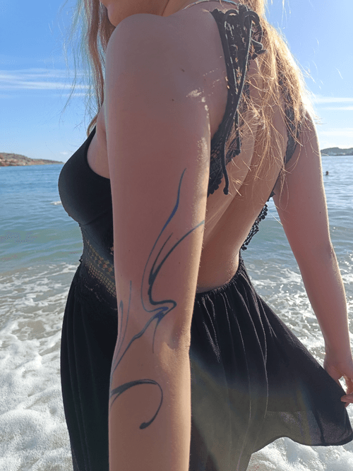 Blue Swirl Arm Tattoo