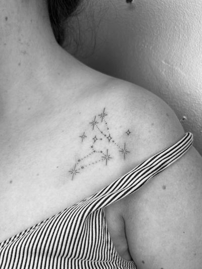 Fine line ornamental tattoo of a beautiful constellation by Inna.