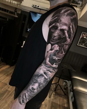 dark creepy black and grey tattoo full sleeve in progress