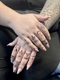 Geometric and Floral Finger Tattoos