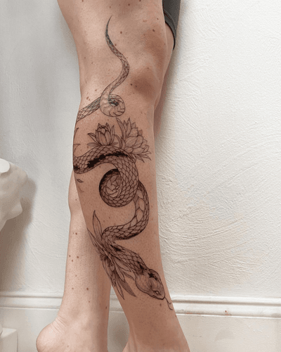 Snake with cactus flowers in fine line style #finelinetattoo #fineline