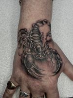 Black and Grey Scorpion Hand Tattoo