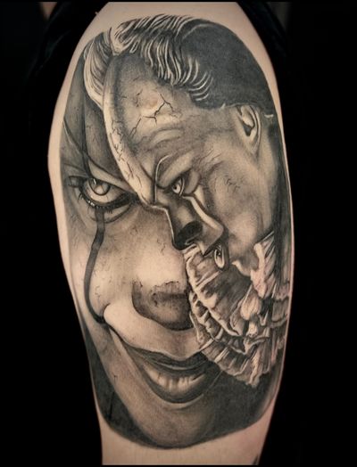 A chilling black and gray tattoo of Pennywise from the movie It, by artist Cara Hayward. True horror brought to life.