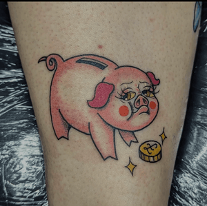 Adorable tattoo of a piggy bank with a cute pig design by GROWN TATTOOS. Perfect for those who love all things pig-related!
