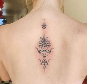 Experience the intricate beauty of ornamental style with this stunning tattoo design created by talented artist Megan Foster.