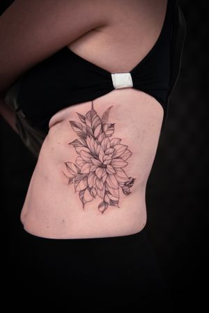 Adorn your skin with a delicate flower design created with meticulous dotwork and fine lines by talented artist Steffan Eagle.