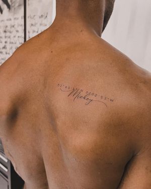 Small lettering and intricate details on dark skin, expertly done by tattoo artist Alex Caldeira.